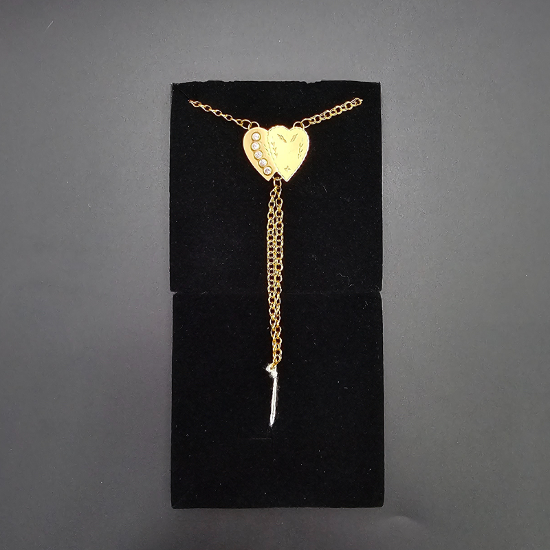 Pulsera doble corazón de oro.